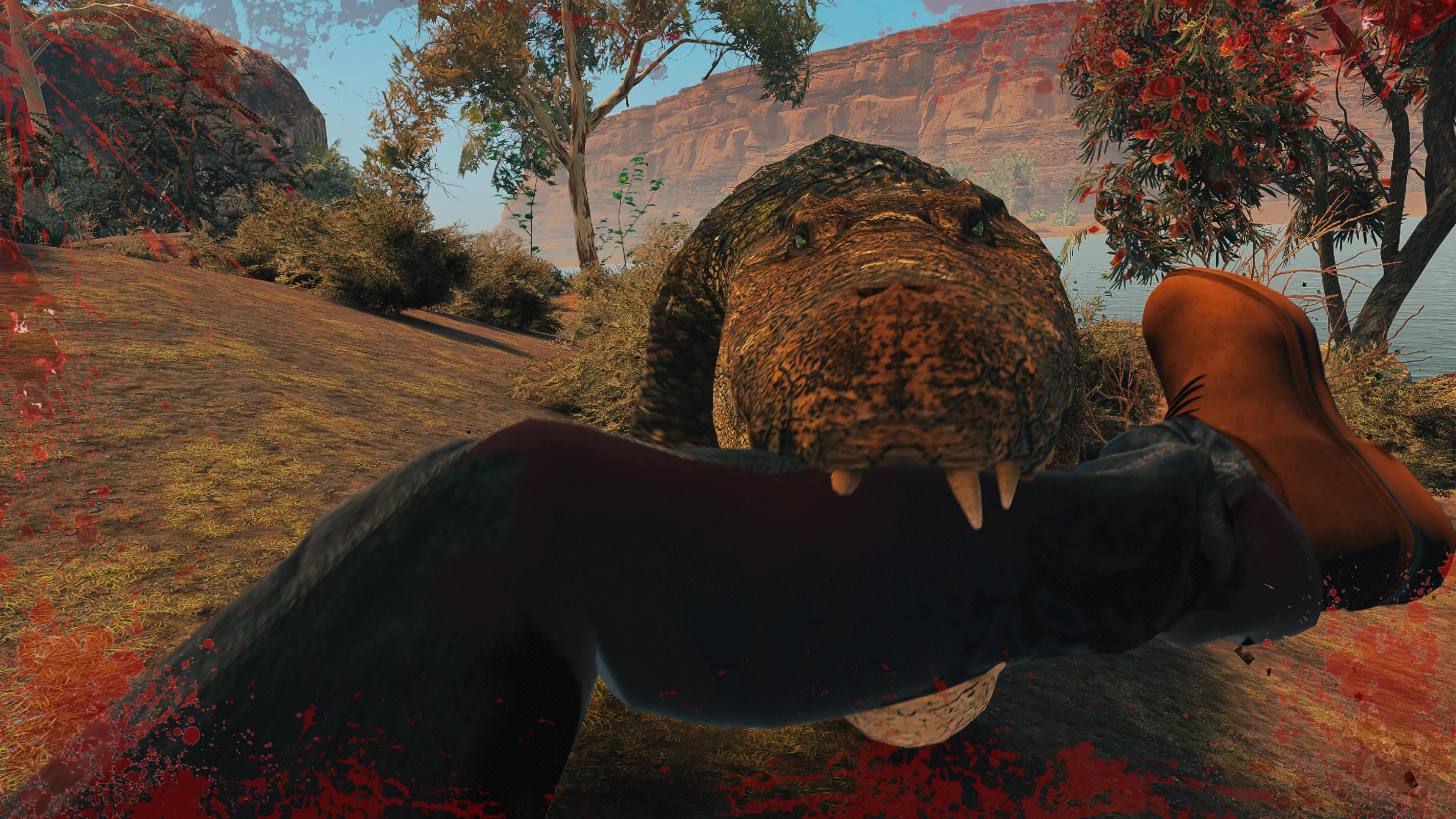 An in-game screenshot where the player grapples with a massive crocodile, its jaws clamped around their leg, dragging them towards the water.